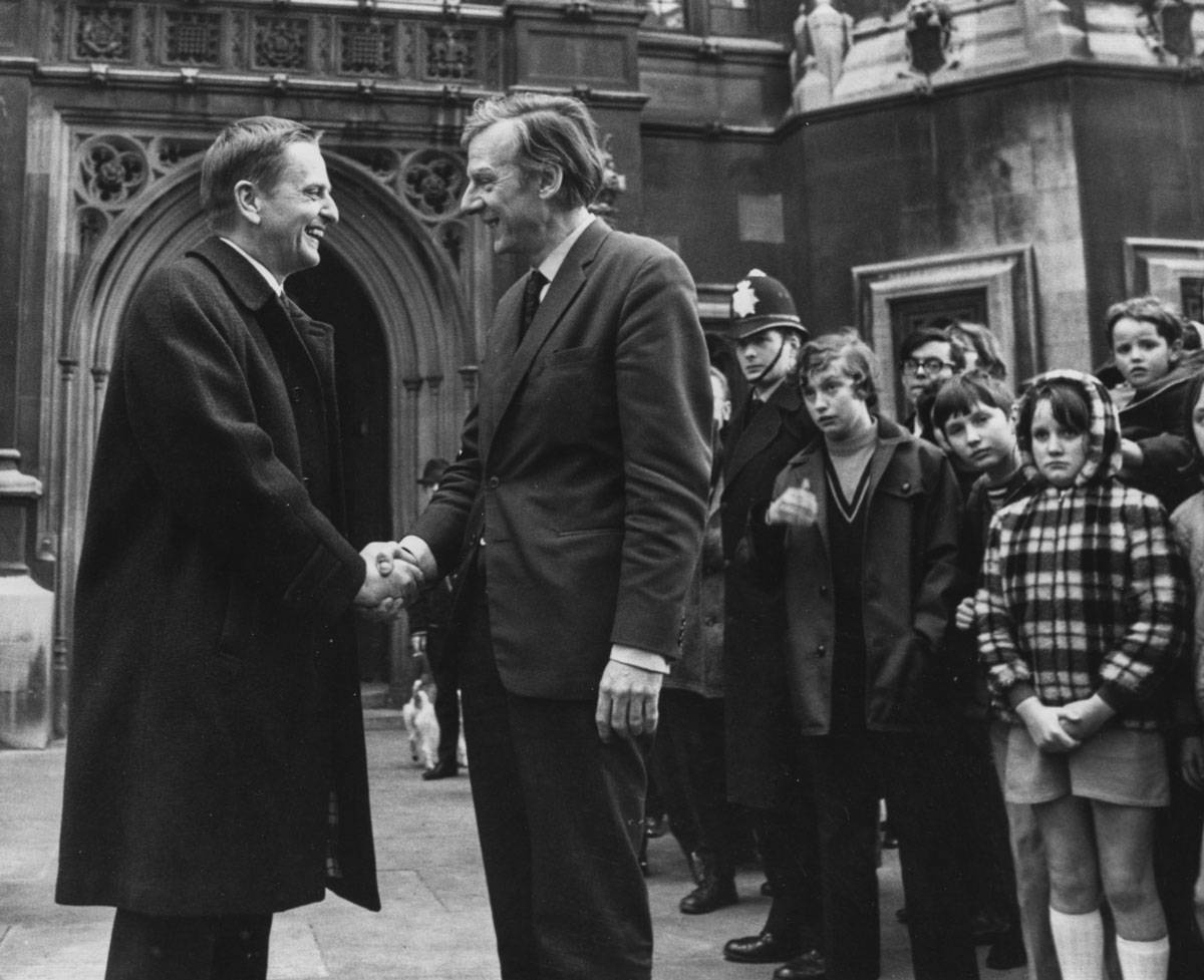Swedish prime minister Olof Palme (left) shaking hands with Labour and Tribune MP Peter Shore at the House of Commons on April 7, 1970